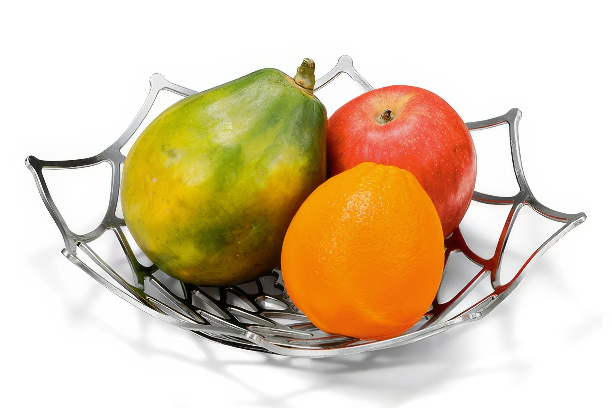 Nousaku KAGO Dahlia tin basket bent into a shallow bowl holding colorful fruit on a white surface, showing the organic curves of hand-shaped 100 percent tin